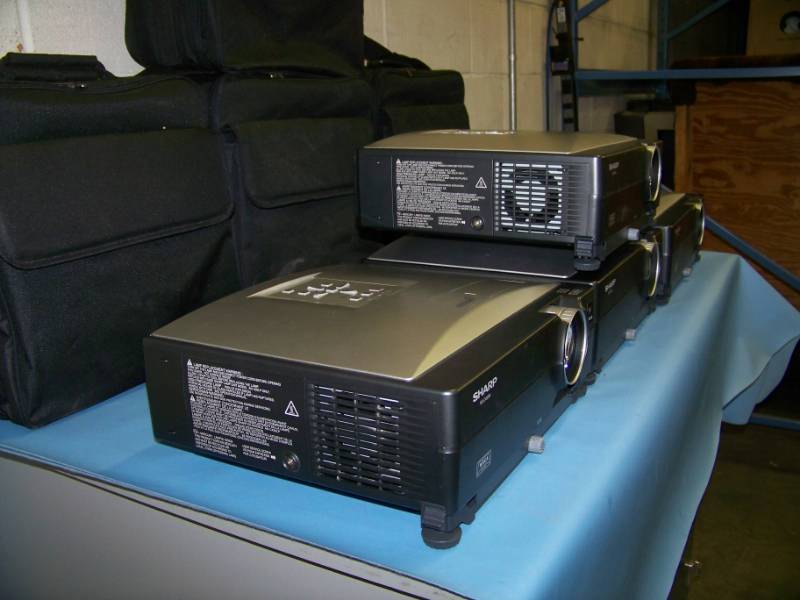 lot 63 image: (4) Sharp, XG-C455, LCD Projectors with (2) Remote Controls and (4) Travel Bags - need lamps
