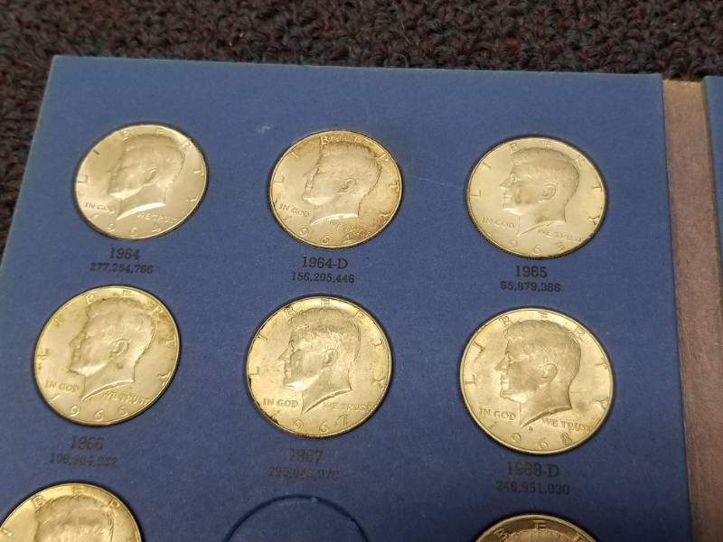 BOOK OF KENNEDY HALF DOLLARS - MANY SILVER COINS INCLUDED