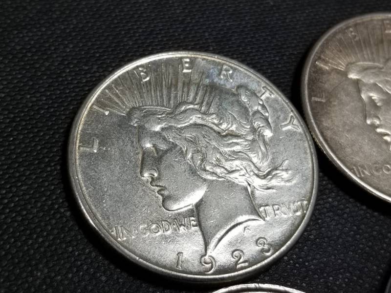 4 SILVER COINS 2 SILVER DOLLARS & 2 OUNCES OF SILVER
