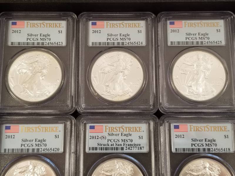 GROUP OF 10 PERFECT PCGS MS70 FIRST STRIKE AMERICAN SILVER EAGLES AS PICTURED