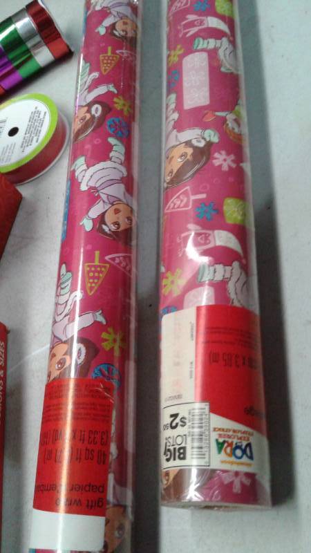 lot 34 image: Bin With Christmas items, Plastic Gingerbread Man, Dora Wrapping Paper