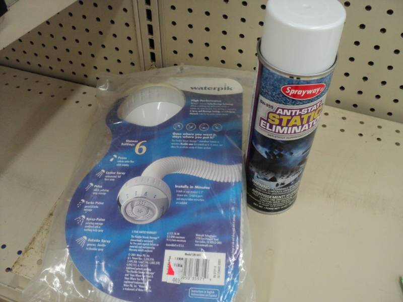 Waterpik shower head and can of ant...