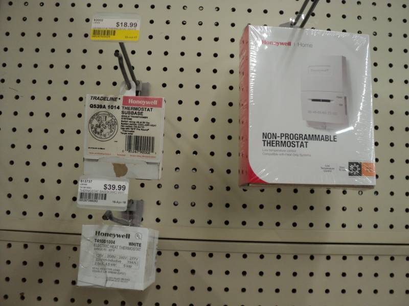2 Honeywell thermostats and a therm...