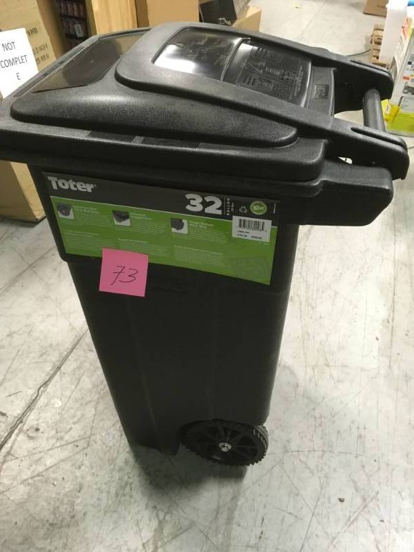 lot 73 image: Toter 32 Gal. Greenstone Trash Can with Wheels and Attached Lid not used