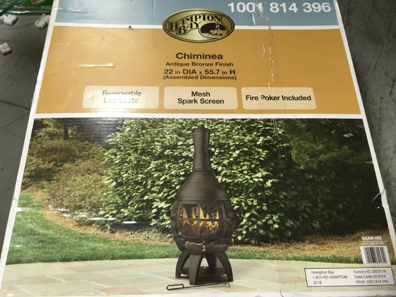 lot 1 image: Hampton Bay 55.5 in. Outdoor Cast Iron Chimenea not used