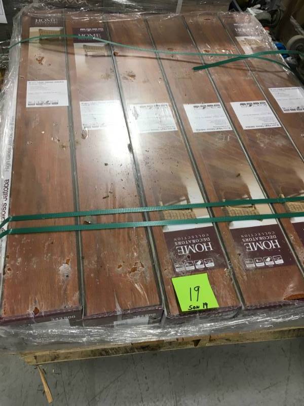 lot 19 image: Home Decorators Collection High Gloss Jatoba 8 mm Thick x 5-58 in. Wide x 47-34 in. Length Laminate Flooring (18.65 sq. ft.  case) LOT OF 19 CASES not used