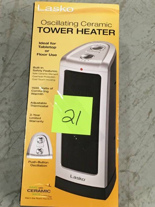 lot 21 image: Lasko 16 in. 1500-Watt Oscillating Ceramic Tower Heater with Manual Control  in like new condition