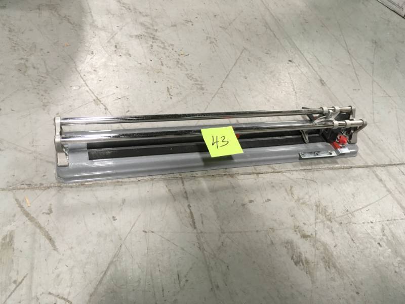 lot 43 image: Rubi 24 in. Practic Tile Cutter  in like new condition