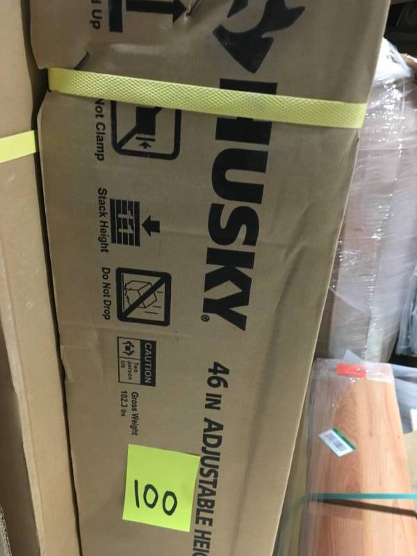 lot 100 image: Husky 46 in. Adjustable Height Work Table not used