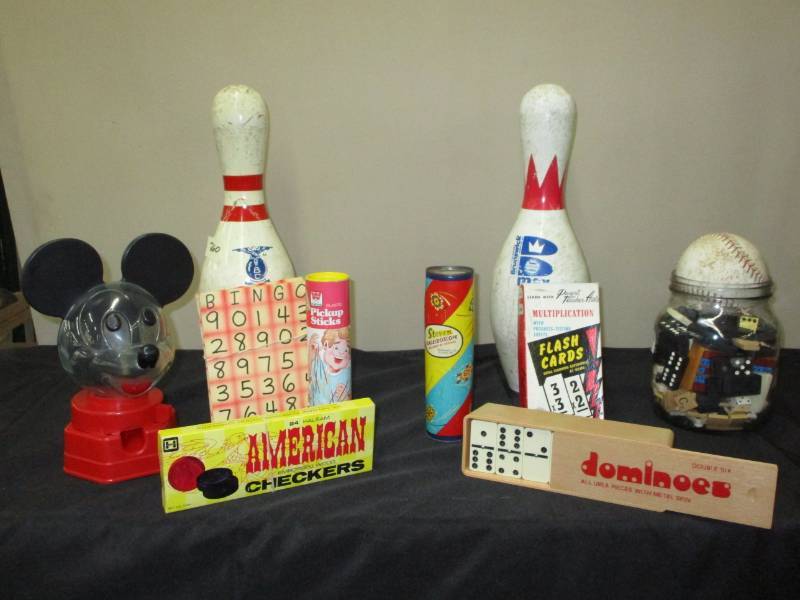 lot 45 image: Bowling pins, Dominoes game, Mickey Mouse gumball machine, other misc games
