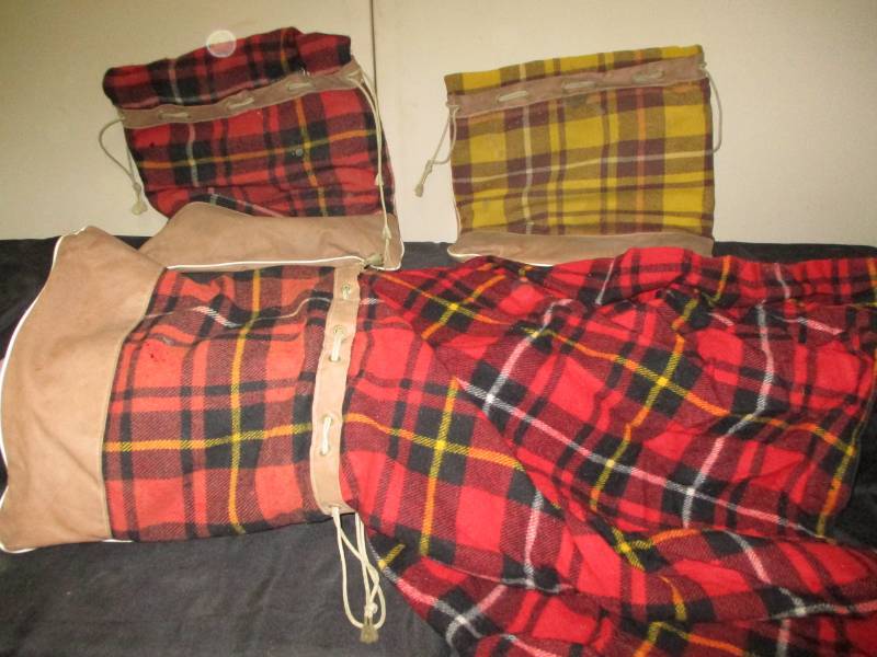 lot 131 image: 3 seat cushions that have fold out blankets in them