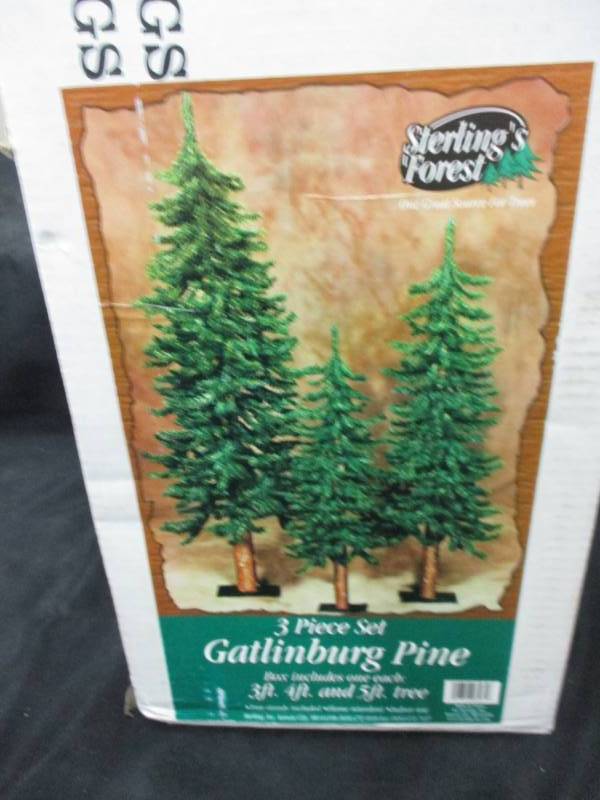 lot 243 image: 3 Piece Set Pine Trees unopened in Box 3 ft, 4 ft and 5 ft
