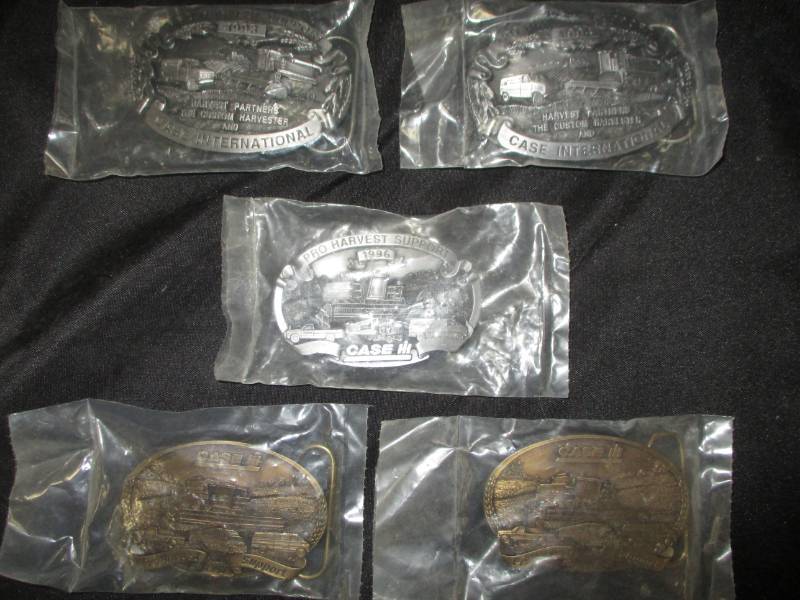 lot 287 image: 5 Case International Commerative belt buckles