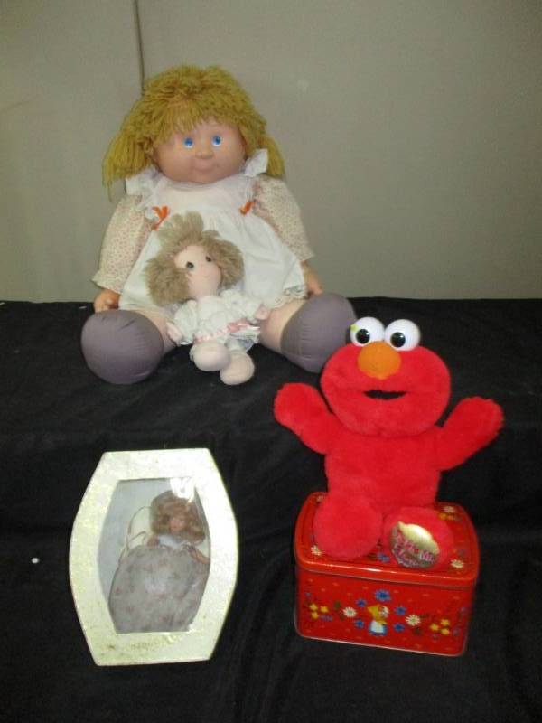lot 319 image: Cabbage Patch Faux Doll, Precious moments doll , Antique Doll, Elmo and more