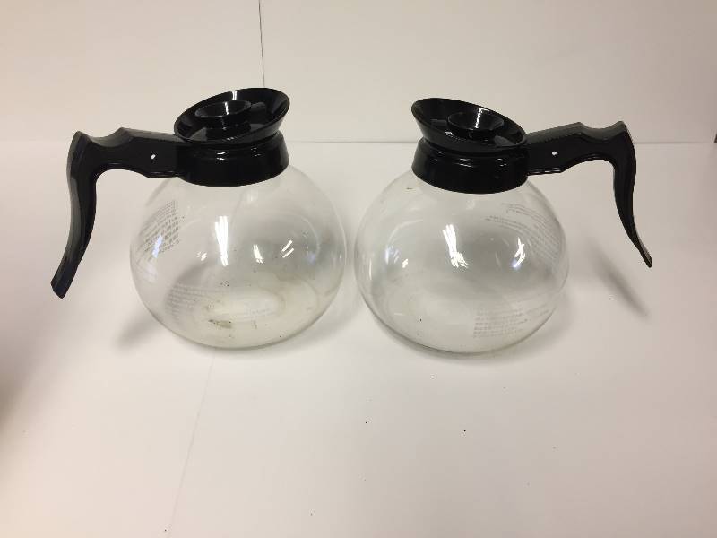 lot 29 image: 2 Glass Coffee Dacanters with Lids