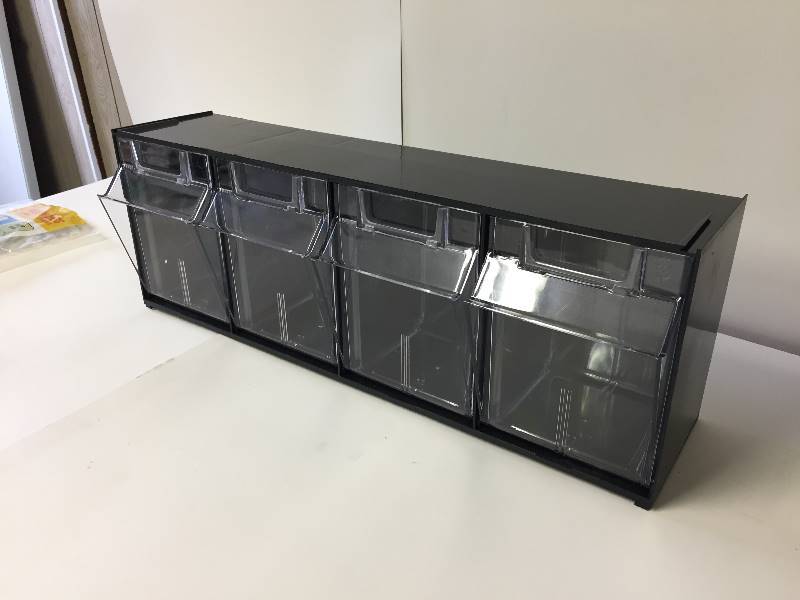 lot 85 image: Black Storage Unit Cabinet with 4 Clear Bins