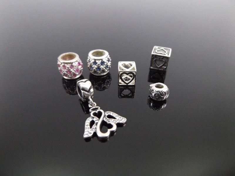 lot 148 image: Lot of .925 Sterling Silver Charms