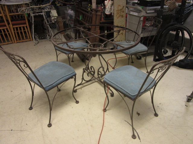 lot 519 image: IRON TABLE WITH FOUR CHAIRS