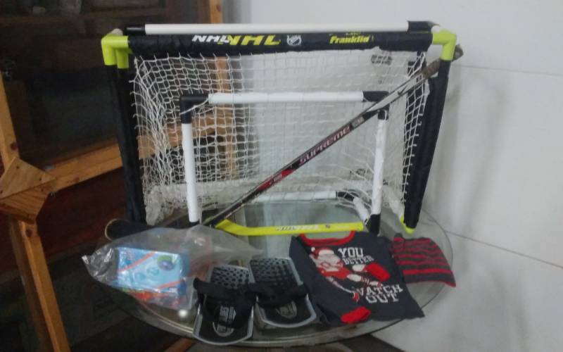 lot 37 image: Hockey Nets, Sticks, Carpet Skates, PJs
