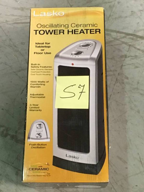 lot 57 image: Lasko 16 in. 1500-Watt Oscillating Ceramic Tower Heater with Manual Control open box in like new condition