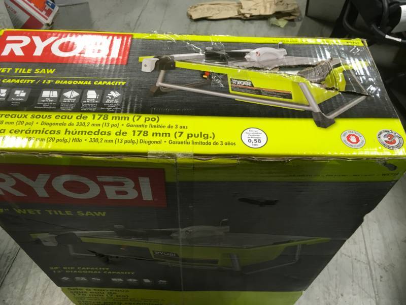 lot 34 image: Ryobi 7 in. 4.8 Amp Tabletop Tile Saw IN WORKING COND. MISSING PARTS