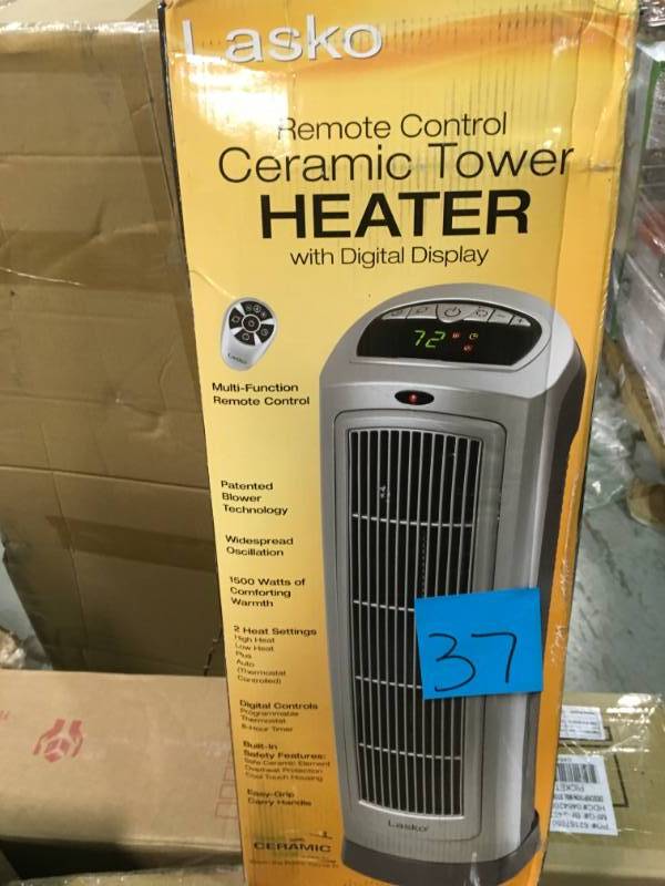 lot 37 image: Lasko 23 in. 1500-Watt Ceramic Tower Heater with Digital Displayopen box in new condition