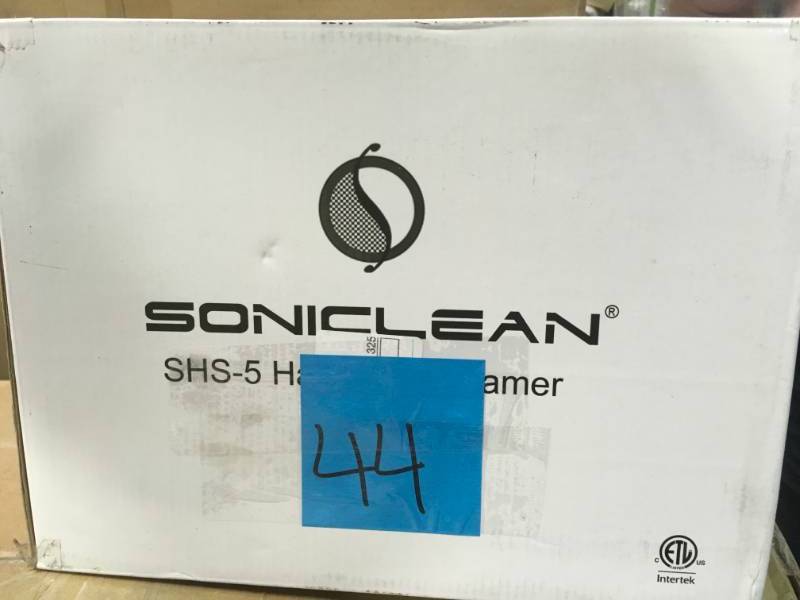 lot 44 image: Soniclean Handheld Steamer with Attachments open box in new condition
