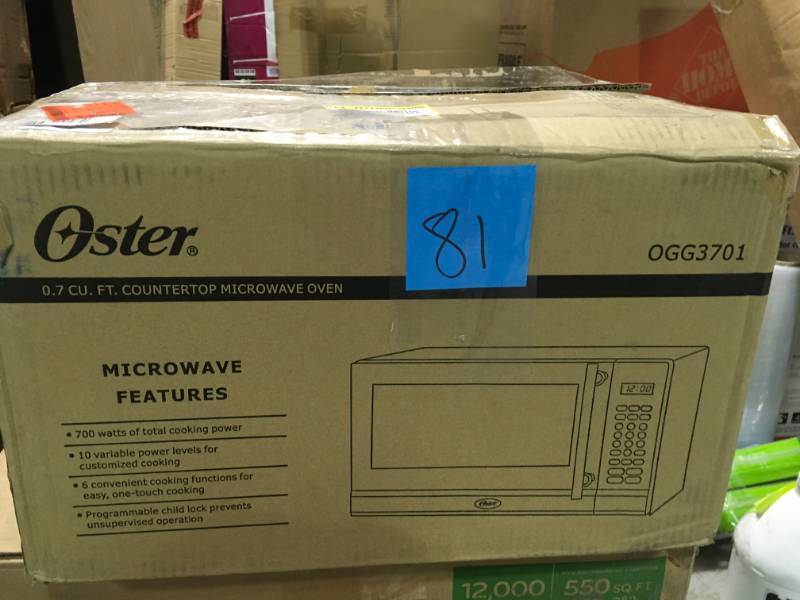 lot 81 image: Oster 0.7 cu. ft. Countertop Microwave in Stainless Steel open box in new condition