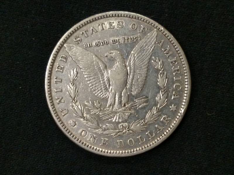 lot 7 image: 1879 Rev 79 Morgan Silver Dollar...