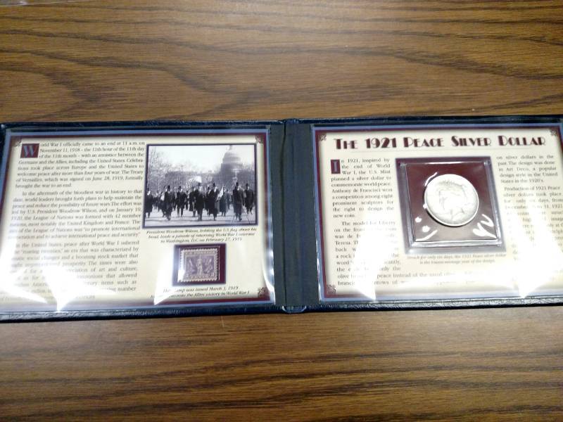 lot 20 image: 1921 Peace Silver Dollar & Stamp Co...