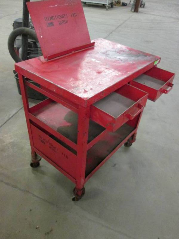 lot 9 image: Metal shop table on wheels...