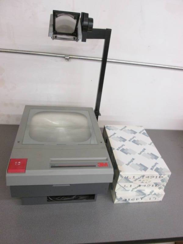 lot 36 image: 4 reams of paper and an overhead pr...