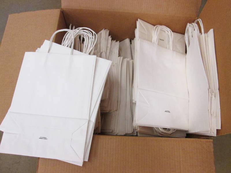 lot 38 image: Box of white handled bags from U-Li...