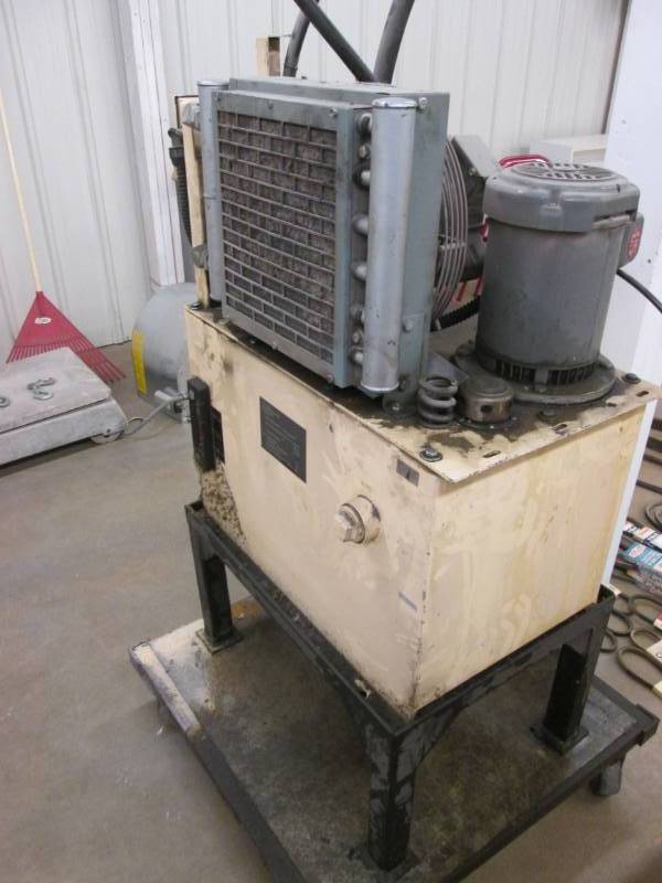 lot 43 image: Oil pump on stand with wheels...