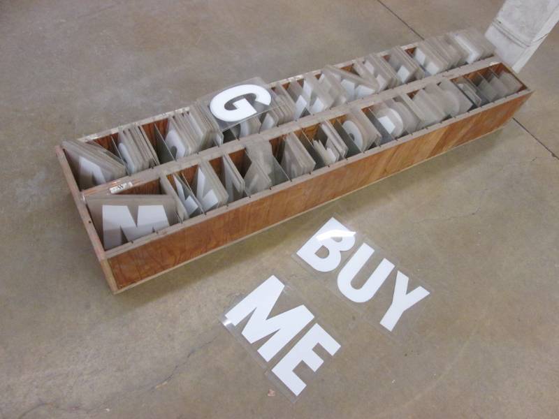 lot 50 image: Wood rack full of 7 sign letters...