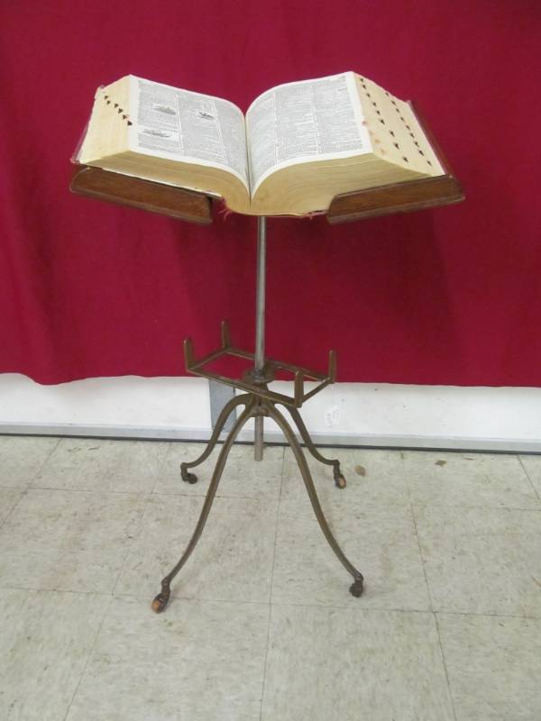 lot 131 image: 1950 Webster Dictionary on vintage metal stand