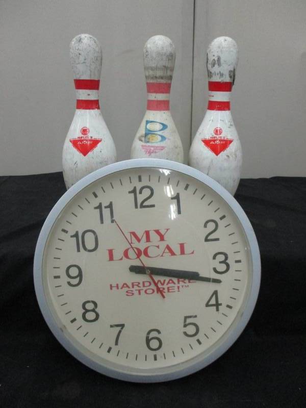3 Bowling Pins and a clock
