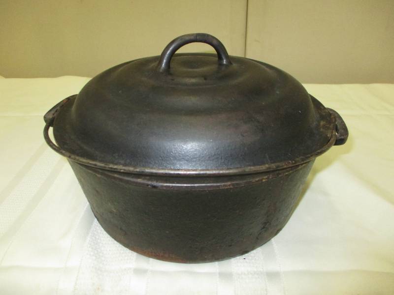 Cast Iron Dutch Ovenwith cover  No numbers on it but 10 across opening and 4 14 deep