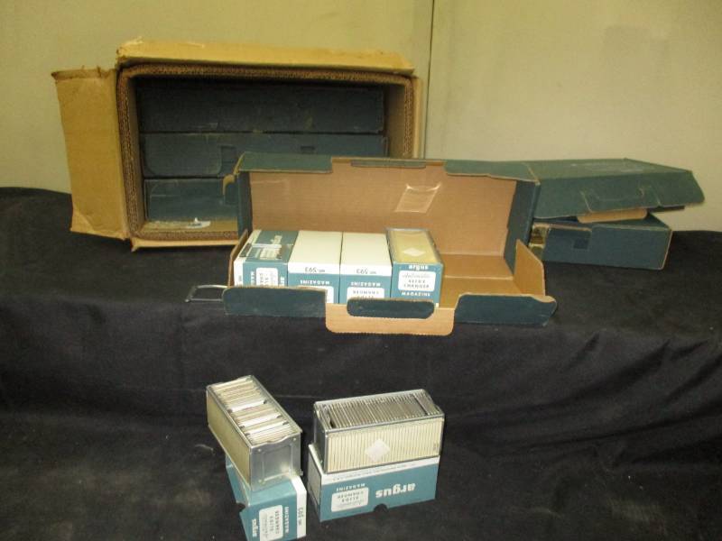 Boxes full of slide changer magazines full of slides of paris and all over