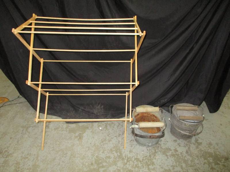 Drying rack and two old wash pails