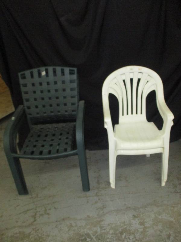 6 patio chairs, 4 green stackable and 2 white
