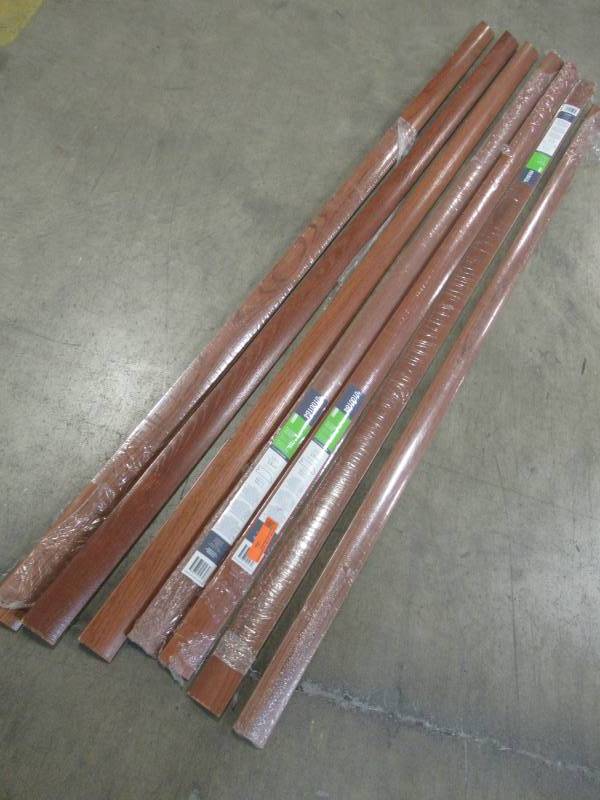 lot 23 image: 7 Pieces of FLEXCO 2.25-in x 78-in Gunstock Red Oak Reducer Floor Moulding, 100164