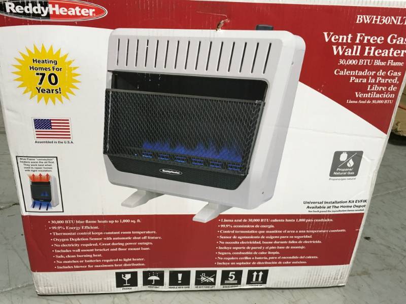 lot 13 image: Reddy Heater 30,000 BTU Blue Flame Dual-Fuel Wall Heater with Blower open box in like new condition