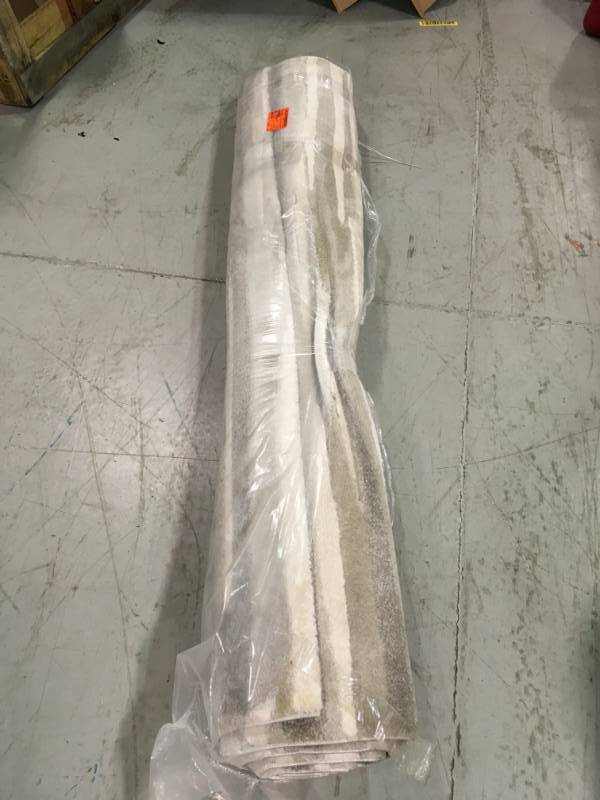 lot 7 image: Home Decorators Collection Water Color Grey 5 ft. x 7 ft. Area Rug  not used