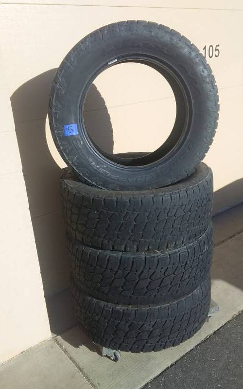 lot 5 image: 4-Nitto AT Grappler E-2 10 Ply MTS Tires 29560R-20. DOT# PD13815. See Pictures To Grade Condition