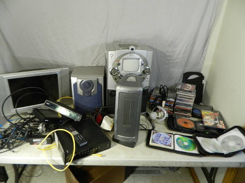 lot 99 image: CDs, Comcast, Electronics