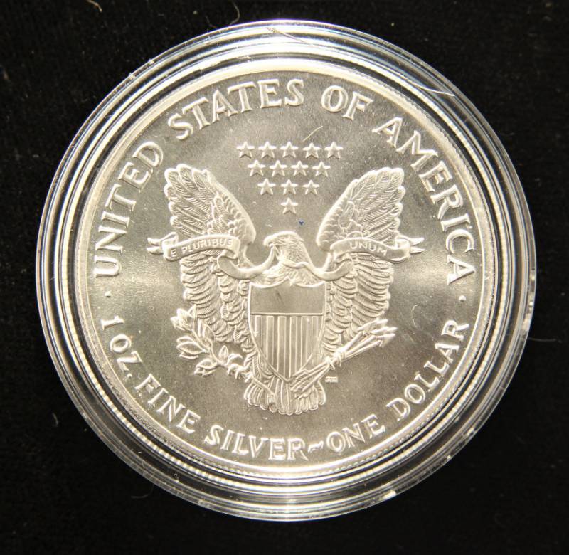 1990 AMERICAN SILVER EAGLE 1 TROY OZ. .999 FINE SILVER IN AIRTITE HOLDER