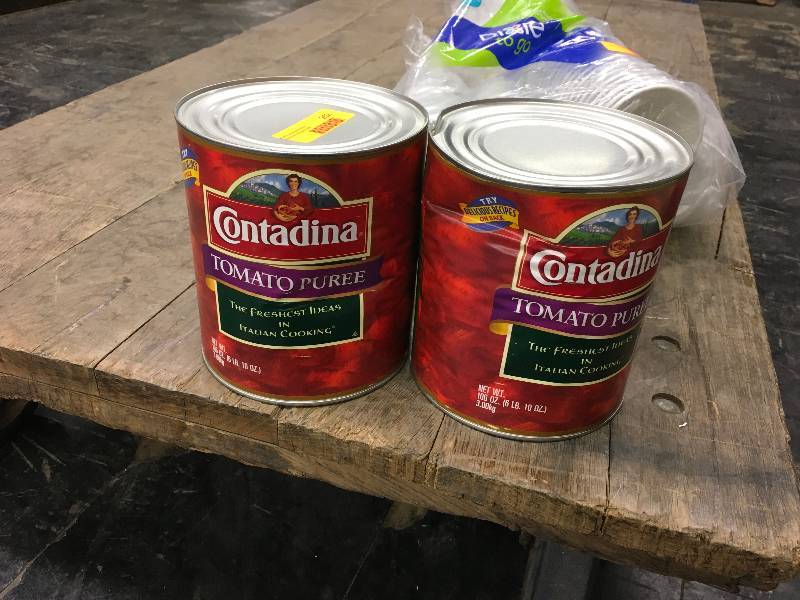 lot 252 image: Two Cans Of Tomato Puree