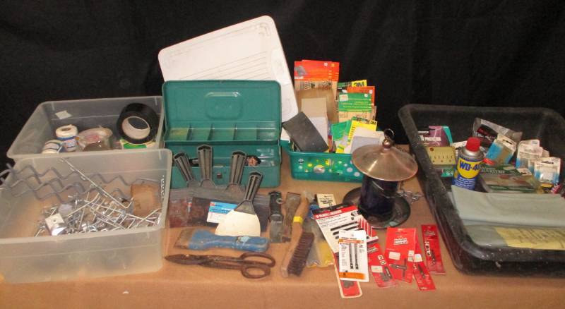 lot 13 image: Sandpaper, Bird feeder, fishing reels, mudding and tapeing knives, jigsaw blades, hardware, canvas, drain pan and more
