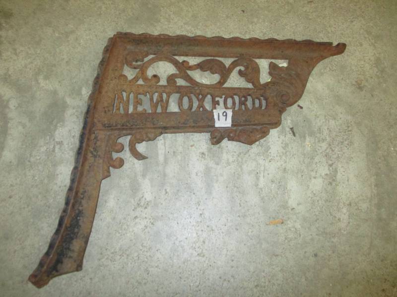 lot 115 image: Cast Iron piece says  New Oxford
